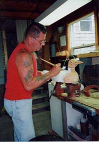 Dick carving in his workshop